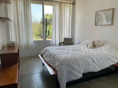 Cama o camas de una habitación en Malanah Casa en la playa y laguna!