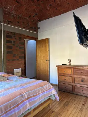 Cama o camas de una habitación en Casa Rústica del pedregal