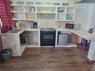 Una cocina o zona de cocina en departamento 2 en condominio