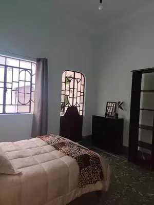 Cama o camas de una habitación en Hospedaje en habitación casa colonial centro histórico Puebla