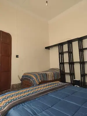 Cama o camas de una habitación en Hospedaje en habitación casa colonial centro histórico Puebla