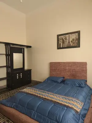 Cama o camas de una habitación en Hospedaje en habitación casa colonial centro histórico Puebla