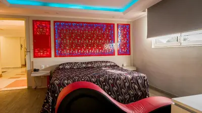 Cama o camas de una habitación en hotel saro