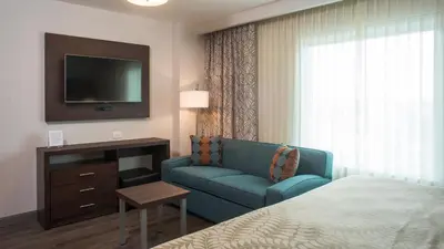 Cama o camas de una habitación en Staybridge Suites Puebla by IHG