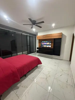 Una televisión o centro de entretenimiento en Casa Acuario