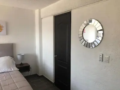 Cama o camas de una habitación en Departamento con ubicacion priviligiada cerca de la playa