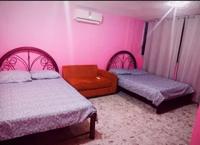 Cama o camas de una habitación en Villa La Rosa Acapulco