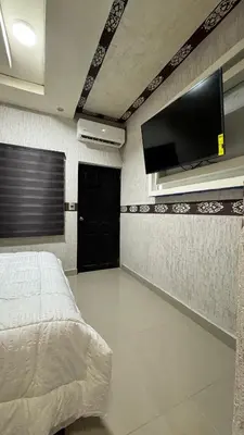 Una televisión o centro de entretenimiento en Hotel VIP