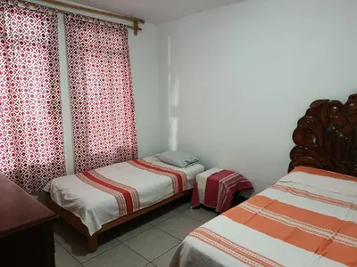 Cama o camas de una habitación en Casa Tradición Oaxaqueña
