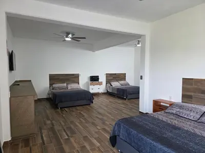 Cama o camas de una habitación en La Casa Blanca VIP