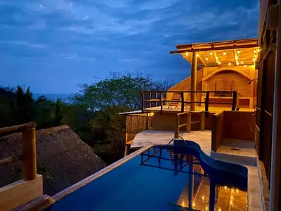 Un balcón o terraza de CASA CON AIRE ACONDICIONADO, PLAYA San Agustinillo Area