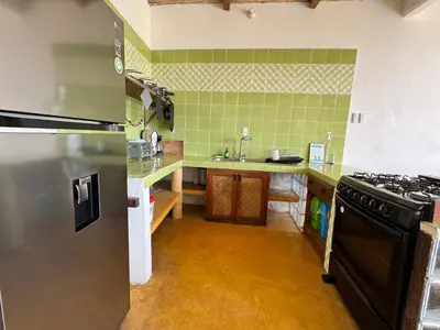 Una cocina o zona de cocina en CASA CON AIRE ACONDICIONADO, PLAYA San Agustinillo Area