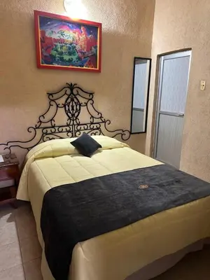 Cama o camas de una habitación en Hotel Los Reyes