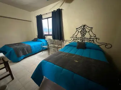 Cama o camas de una habitación en Hotel Los Reyes