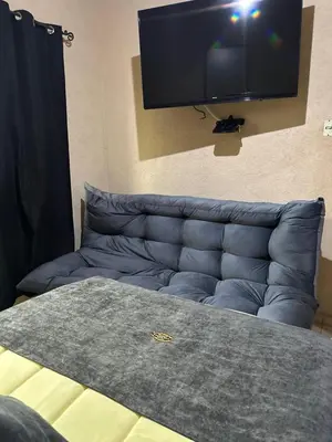 Una televisión o centro de entretenimiento en Hotel Los Reyes
