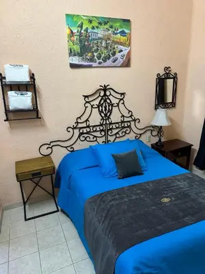 Cama o camas de una habitación en Hotel Los Reyes