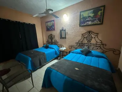 Cama o camas de una habitación en Hotel Los Reyes