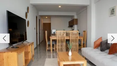 Una televisión o centro de entretenimiento en HABITACIÓN Torres Palmas alberca, vista al mar, Roof Top VIP