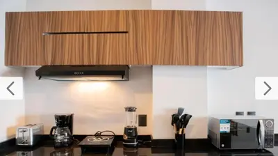 Una cocina o zona de cocina en HABITACIÓN Torres Palmas alberca, vista al mar, Roof Top VIP