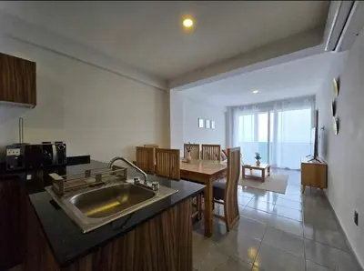 Una cocina o zona de cocina en HABITACIÓN Torres Palmas alberca, vista al mar, Roof Top VIP