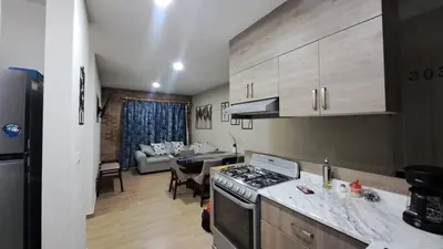 Una cocina o zona de cocina en Departamento Oasis