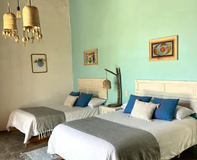 Cama o camas de una habitación en Hacienda Santa Barbara Casa Malinche