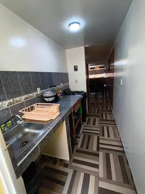 Una cocina o zona de cocina en Alojamiento en Tlaxco