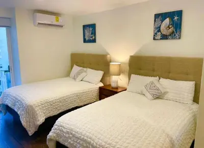 Cama o camas de una habitación en SKY INN Oficial Acapulco Suites & Condo Mediterrane