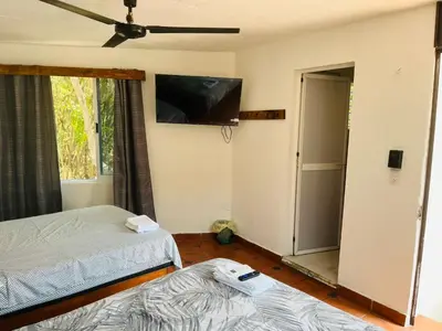 Cama o camas de una habitación en Casa Iguanas, ubicación inmejorable en la bahia principal