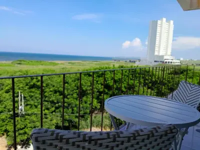 Un balcón o terraza de Depa Isla del Amor con alberca, y acceso al río y la playa