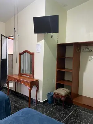 Una televisión o centro de entretenimiento en Hotel Real de Juarez
