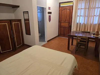 Cama o camas de una habitación en Casa Lua Oaxaca: Comfort y Cultura