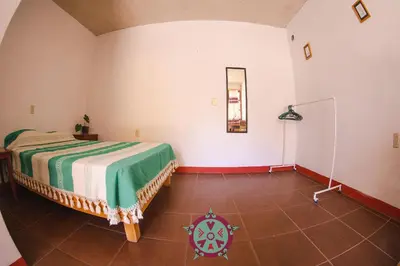 Cama o camas de una habitación en Casa Lua Oaxaca: Comfort y Cultura