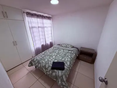 Cama o camas de una habitación en Departamento nuevo en Puebla
