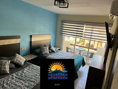 Cama o camas de una habitación en Villa diamante Acapulco