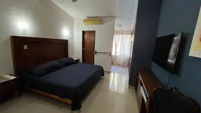 Una televisión o centro de entretenimiento en Casa Grillo Huatulco