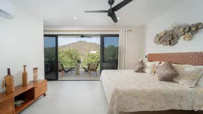 Cama o camas de una habitación en Ziba Condos Departamento con terraza