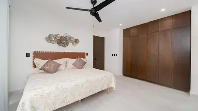 Cama o camas de una habitación en Ziba Condos Departamento con terraza