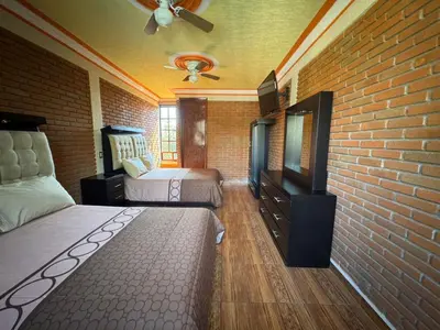 Cama o camas de una habitación en casa malinalco, jalmolonga el puentecito