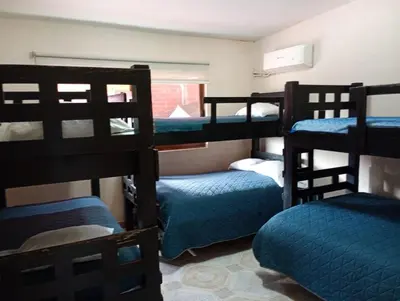 Cama o camas de una habitación en La Palma Yatzil