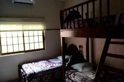Cama o camas de una habitación en La Palma Yatzil