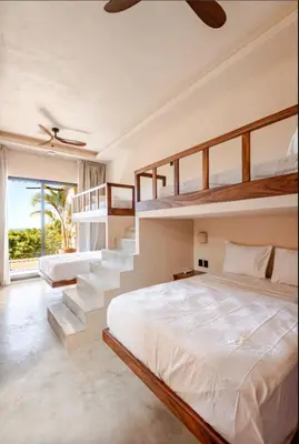 Cama o camas de una habitación en La Barra Resorts Luxury Villas