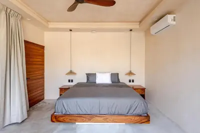 Cama o camas de una habitación en La Barra Resorts Luxury Villas