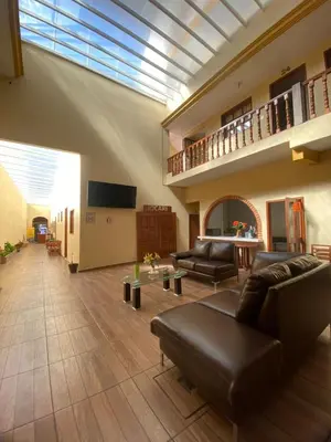 Una televisión o centro de entretenimiento en Hotel Jocari