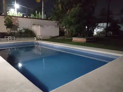 Piscina en o cerca de Alberca y jardín Palmeras