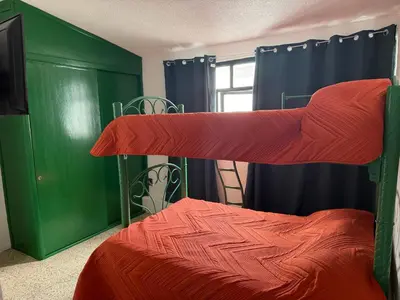 Cama o camas de una habitación en Casa amplia, cómoda y céntrica