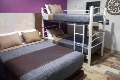 Cama o camas de una habitación en Auto Hotel Express