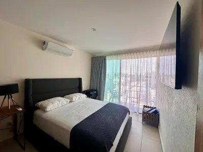Cama o camas de una habitación en Casa Lila - Apartment with rooftop & jacuzzi