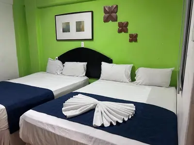 Cama o camas de una habitación en Hotel puerta de mar