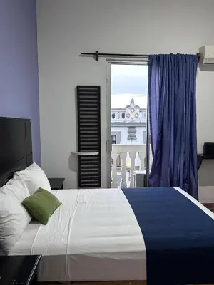 Cama o camas de una habitación en Hotel puerta de mar